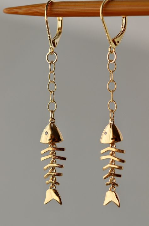 "Cute 3D Shiny Gold Plated or Silver Plated  Fish Skeleton movable charm 26 x 7 mm Cubic zirconia tiny \"eyes\" Gold plated Chain or Sterling Silver chain. Gold Plated or Silver Plated  over the brass Lever Back Clasps. The total length is 2.5 inches or 65 mm long. Please let me know if you want these earrings longer or shorter. Your order will be wrapped and shipped in jewelry box. For better use of this necklace please keep it dry, out of pool water or any moisture .    If you would like to or Fish Skeleton Jewelry, Silver Charm Earrings, Movable Jewelry, Skeleton Jewelry, Fish Skeleton, Fish Pendant Necklace, Fish Earrings, Fish Jewelry, Ocean Jewelry