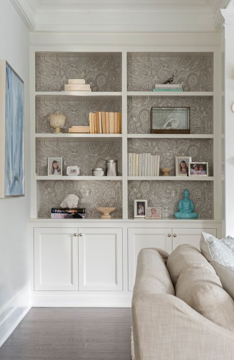 Family room built-in game cabinets and designer shelves Wallpapered Bookshelves, Wallpaper Built In Shelves, Alcove Living Room, Wallpaper Bookcase, Wallpaper Bookshelf, Glamour Interiors, Entry Area, Mini Chef, High Ceiling Living Room