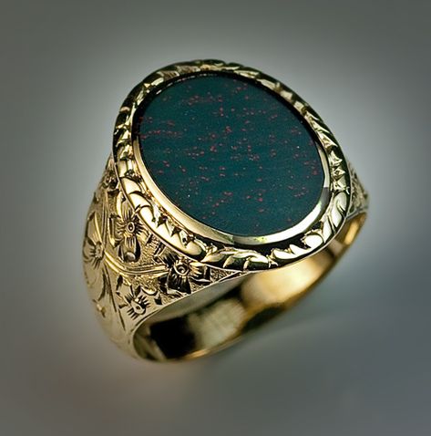 A Bloodstone and Gold Signet Ring circa 1880 A Victorian era antique 14K greenish yellow gold ring is set with a flat oval heliotrope - a variety of chalce Antique Mens Rings, Bloodstone Jewelry, Coining, Mens Ring Designs, Bloodstone Ring, Mens Gemstone Rings, Mens Rings, Mens Gold Jewelry, Fancy Rings