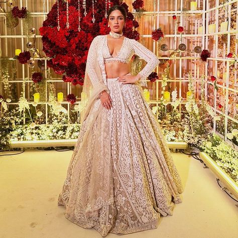 The gorgeous @bhumipednekar stuns in our handcrafted nude colour lehenga. Enhanced with ivory threads, sequin, and pearl embroidery, she… | Instagram Pearl Tassels, Seema Gujral, Bhumi Pednekar, Nude Colour, Wedding Lehenga Designs, Pearl Embroidery, Net Lehenga, Indian Couture, Wedding Lehenga