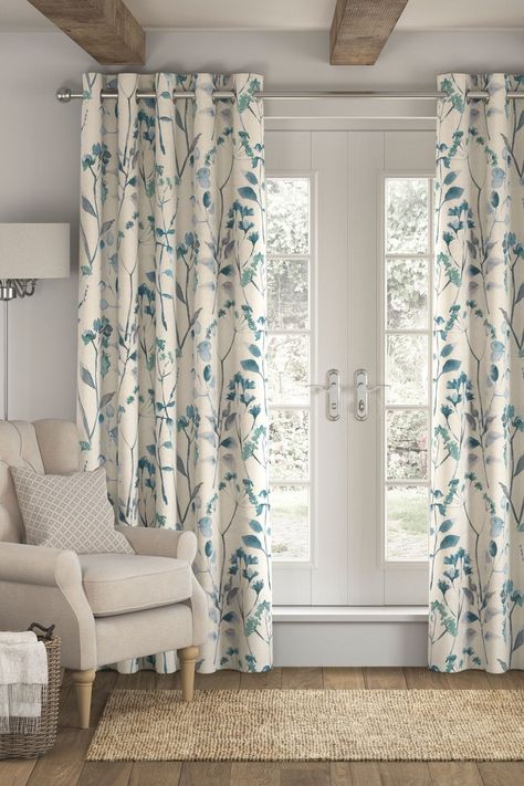 Our Isla curtains are designed with a beautiful watercolour floral print that'll add style to every space. With a thick blackout lining designed to shut daylight out with dramatic light exclusion while also keeping heat in during the winter and the room cool during the summer. Brushed silver eyelets make them easy to pair with a new or existing curtain pole. Dry clean only. 2 x Curtains Main 100% Cotton. Lining 52% Polyester with acrylic backing, 48% Cotton with acrylic backing. Blue Floral Curtains, Blue Curtains Living Room, Curtains Living Room Modern, Simple Curtains, Eyelet Curtains, Blue Curtains, Inspire Me Home Decor, Blossom Print, Curtains Living