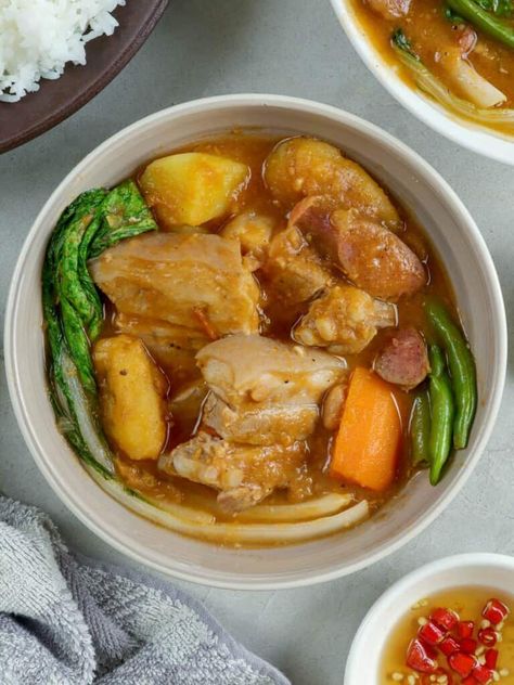 Pork Pochero is the ultimate comfort food! Chockful of tender pork belly, beans, smoky sausage, vegetables, and rich tomato sauce, this Filipino stew is hearty, flavorful and perfect for cold weather. Chicken Sotanghon Soup, Roasted Pork Tenderloin Recipes, Midday Snack, Roasted Pork, Tenderloin Recipes, Pork Tenderloin Recipes, Foot Soak, Hawaiian Food, Filipino Food