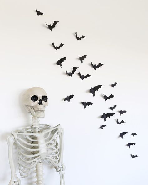 Learn how to make these easy paper bats for your walls, mirror, fireplace, or kitchen cabinets (so many possibilities!). This is a cheap Halloween decor idea that makes a huge impact! Easy Halloween decor for an office, classroom, ward party, and more! Diy Bats Decoration, Sticky Bats On Wall, Fake Bats On Wall, Paper Bats Hanging From Ceiling, Paper Bats On Walls, Cheap Easy Halloween Decorations, Halloween Paper Bats On Wall, Bat Wall Decor Halloween Decorations, Halloween Bat Wall Decor