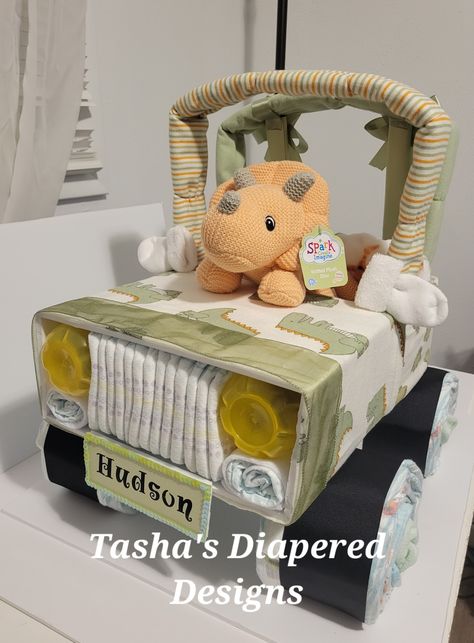 Cute jeep I made for a customer. Diy Jurassic Park Jeep Cardboard, Safari Jeep Cardboard Diy, Diaper Jeep, Palm Tree Themed Baby Diaper Cake, Jeep Diaper Cake, Diaper Cake Tutorial, Jeep Diaper Cake Instructions, Diaper Cakes Tutorial, Diy Jeep