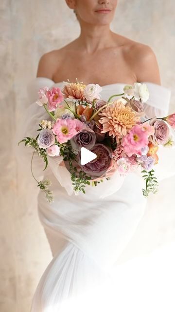 HERITAGE on Instagram: "One more time for this bouncy bouquet ☝🏽 Just love when the flowers dance.

Florals & video: @heritagegatherings 
Gown: @ticbridal 
Designer: @alenaleenabridal 
Hair: @bridal_bynatalie 
Makeup: @makeupkort 
Model: @laurenbushbyoakes 
Floral stems provided by @prestige.botanicals @ibuyflowers" Bouncy Bouquet, Flower Dance, The Flowers, Just Love, Makeup, Flowers, Floral, Hair, Instagram