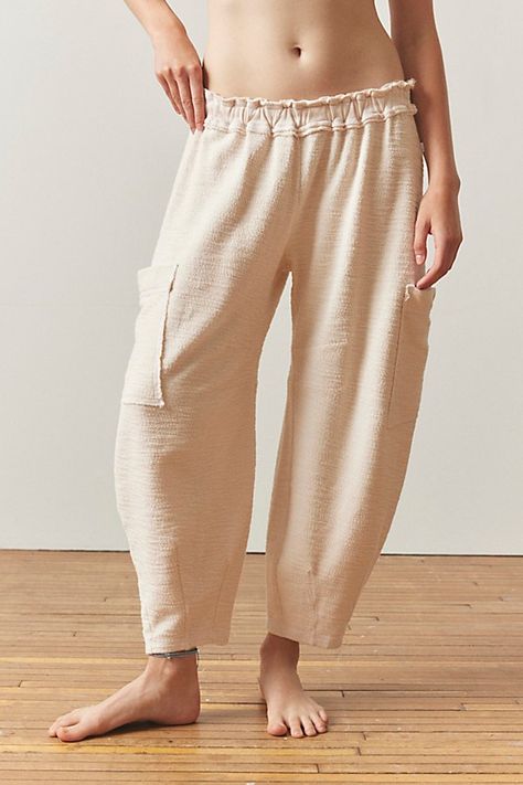 So cozy Out From Under sweatpants in a relaxed jogger style. Featuring a ruffled elastic waistline and oversized slouchy pockets. Only at Urban Outfitters. Features Out From Under Beau sweatpant Lounge joggers Soft and stretchy knit Ruffled elastic waistline Jogger pants with tapered ankle with oversized, slouchy pockets Relaxed fit Tapered ankle length Easy pull-on style UO exclusive Content + Care 100% Cotton Machine wash Imported Size + Fit Model in Ivory is 5’10" and wearing size Small Measurements taken from size Small Waist: 22" Inseam: 23.5" | Out From Under Beau Sweatpant in Ivory, Women's at Urban Outfitters Urban Outfitters Clothes, Fashion Joggers, Women Men Shoes, Small Waist, Jogger Pants, Ankle Length, Women's Intimates, Womens Bottoms, Fashion Forward