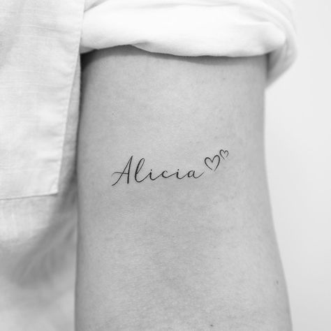 Hubby Name Tattoo Ideas, Millie Tattoo Name, Ellie Name Tattoo, Lexi Tattoo Name, Alicia Tattoo Name, Mila Tattoo Name, Fine Line Name Tattoos For Women, Fine Line Name Tattoo Arm, Dainty Name Tattoos For Women