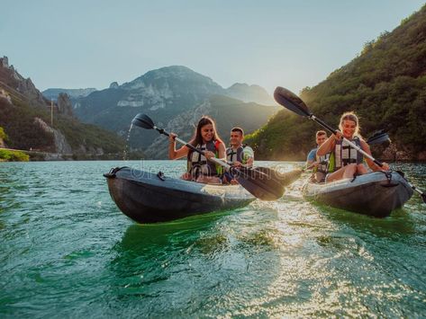 A group of friends enjoying fun and kayaking exploring the calm river, surrounding forest and large natural river stock images Family Kayaking, Kayaking With Friends, Aesthetic Kayaking Pictures, Kayak Pictures, Kayaking Aesthetic Lake, Kayaking River, Photo Grouping, Couples Images, Group Of Friends