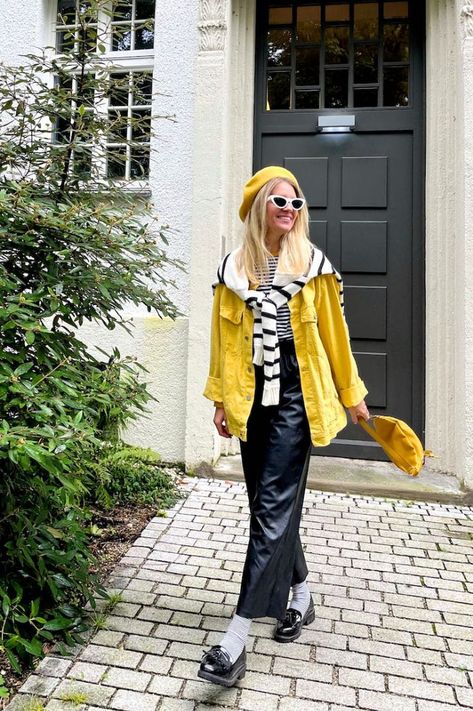 Girl with blonde hair wearing a striped sweater, striped tee, yellow beret, white cat-eye sunglasses, yellow denim jacket, yellow belt bag, faux leather pants, striped socks and loafers. Yellow Beret Outfit, Poses Practice, Yellow Denim Jacket, Yellow Beret, Socks And Loafers, Beret Outfit, Girl With Blonde Hair, Sunglasses Yellow, Yellow Socks