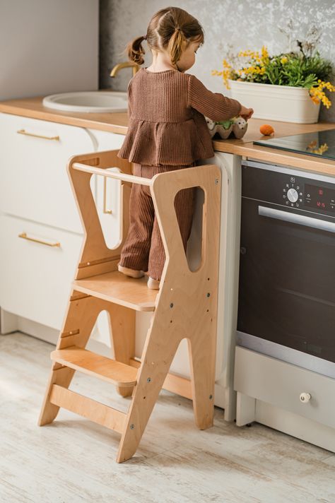 It allows kids to participate in cooking, baking, and other kitchen activities alongside adults. It's an excellent way for children to build confidence and foster a sense of independence in the kitchen and in other daily processes. That toddler tower can be used to help children reach higher places to wash their hands, brush their teeth, or access other areas where adult assistance is required. Toddler Tower, Kitchen Tower, Toddler Step Stool, Kitchen Step Stool, Childrens Kitchens, Kitchen Help, Montessori Furniture, Learning Tower, Step Stool Kids