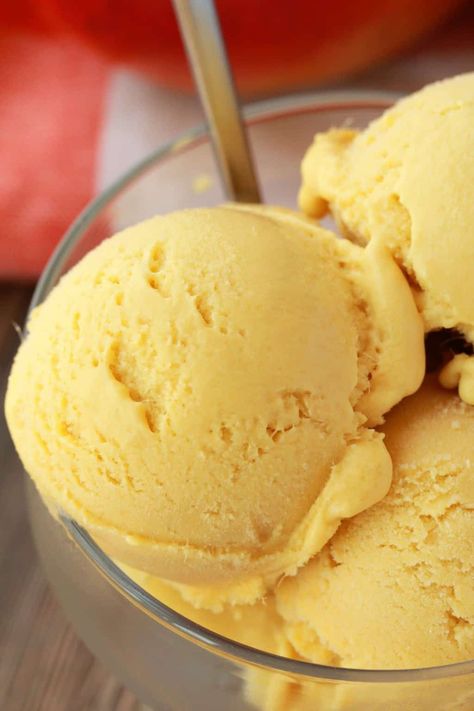 Creamy and divinely textured vegan mango ice cream. This easy 5-ingredient recipe is perfectly sweet, a gorgeous color and has all the mango flavor you could dream of! #vegan #lovingitvegan #veganicecream #vegandessert #dairyfree #glutenfree | lovingitvegan.com Vegan Mango Ice Cream, Peach Sorbet Recipe, Mango Sorbet Recipe, Passion Fruit Ice Cream, Yellow Ice Cream, Pumpkin Pie Ice Cream, Pumpkin Recipes Easy, Mango Ice Cream, Peach Ice Cream