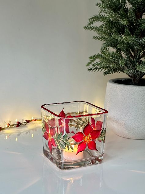 "Candle holder painted with poinsettia great for votive or tea light candles. Great grab bag gift!  Beautiful gift idea great for dining room or  living room.  The listing is for ONE candle holder only, dimensions 3\"x3\". Available to purchase pitcher or stemless glasses with same pattern click the link : https://etsy.me/3HeOrPp Available poinsettia vase from link below: https://jolanscrafts.etsy.com/listing/1593736893" Tea Light Holder Ideas, Glass Candle Holders Decorating Ideas, Christmas Glass Painting Ideas, Dollar Tree Candle Holders, Christmas Tea Light Holder, Christmas Votives, Glass Decoration, Wine Glass Art, Stained Glass Paint