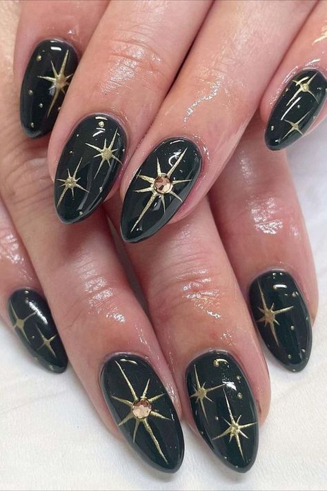 Shine like a star with these simple yet stunning dark green nails by @swoonnails adorned with radiant gold stars nail art. Embrace celestial elegance with this chic and captivating design, perfect for adding a touch of glamour to your everyday look. Nailustrous is your go-to inspiration website for nail enthusiasts! Dive into the best 25 dark green nail design ideas and elevate your manicure game today. Dark Nails With Gold Accent, 90s Grunge Nails, Dark Green Nails Aesthetic, Goth Wedding Nails, Goth Gel Nails, Simple Goth Nails, Alternative Nails Designs, Dark Green And Gold Nails, Dark Aesthetic Nails