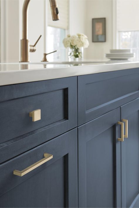 Navy cabinets are very popular, and it's easy to see why. They give kitchens a modern vibe and can feel moody or classy. But what color hardware goes ... | Add Elegance with Champagne Bronze Navy Kitchen Cabinets, Cabinet Hardware Size, Navy Cabinets, Bronze Cabinet Pulls, Navy Kitchen, Bronze Kitchen, Cabinets Drawers, Champagne Bronze, Modern Bar