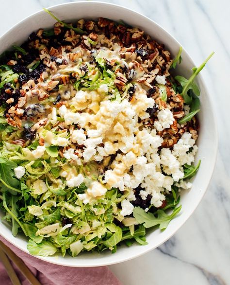 Cookie and Kate on Instagram: “This large salad is made with baby arugula, shredded Brussels sprouts, crumbled goat cheese, and toasted pecans. ✨✨I tossed all of that…” Chopped Salad Low Calorie, Chopped Protein Salad, Homemade Chopped Salad, Make Ahead Chopped Salad, Meal Prep Chopped Salad, Chopped Cobb Salad Recipes, Diy Chopped Salad Kit, Wildfire Chopped Salad Recipe, Finely Chopped Salad Recipes