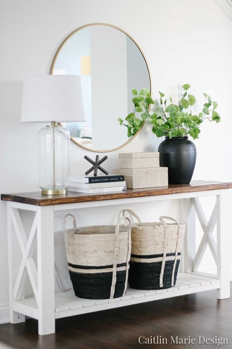 Use these simple entryway styling ideas to create an inviting and functional space! Achieve a high end look while sticking to a budget. | Round brass mirror, black vase, black striped baskets, McGee and Co asterisk Entryway Update, Entrance Tiles, Simple Entryway, Entryway Styling, Round Brass Mirror, Receiving Area, Mcgee And Co, Entryway Style, Console Table Decorating