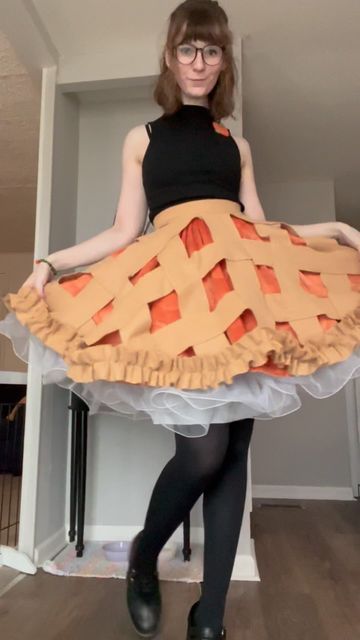 Lauren on Instagram: "Repurposing the apple pie skirt, which I originally made years ago for an American Pie themed party, with a pumpkin underskirt for Thanksgiving  Honestly surprised by how much use I’ve gotten out of this over the years" Unique Outfit Designs, Candy Corn Outfit, Apple Core Outfits, Apple Inspired Outfits, Apple Themed Outfit, Character Accessories Ideas, Apple Aesthetic Outfit, Apple Character Design, Sewing Outfit Ideas