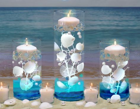 PRICES MAY VARY. Bring the beach to your event and transform ordinary vases into EXTRAordinary centerpieces with these eye-catching vase decorations for resort beach-theme weddings, anniversaries, bridal showers, baby showers, birthdays, Summer events, home/office, gifts, and more... Fills 1 gallon of 100 Floating Natural White Seashells 2"(5cm) - 1"(2cm), 37pc, tall realistic White Coral Reefs 3pc, Shiny White Pearls 40pc 0.75"(2cm) & Vivid Aqua Sea Color Effect Translucent Gels 30pc , and Tran Warm White Fairy Lights, White Fairy Lights, White Fairy, Sea Colour, Light Images, Beach Theme Wedding, White Coral, Vase Fillers, Candle Vase