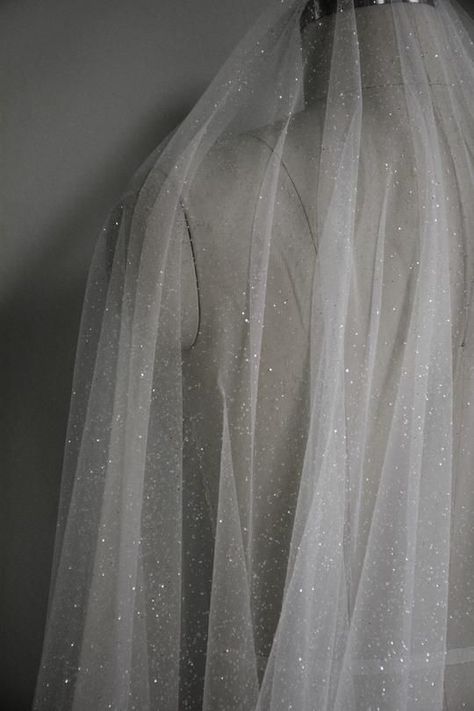 In a word? Magic. Sensational all-over sparkle and nearly illicit levels of glamour make the Capella sparkling wedding veil a must-have for brides coveting a jaw-dropping wedding day look. Designed for the confident and glamorous bride, this extraordinary veil is made of an ultra-sheer sparkling tulle