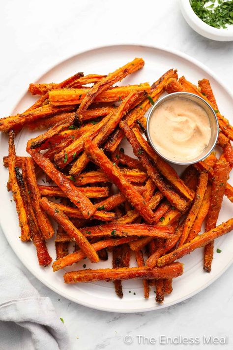 Have you ever tried carrot fries? If not, you need to! They're an easy-to-make, delicious, and healthy side dish. Seasoned to perfection, the sweetness of the carrot amplifies as the natural sugars caramelize, and the outside becomes crispy and delicious while the inside stays soft. Carrot fries are a healthy recipe that feels like a treat! #theendlessmeal #carrots #carrot #carrotfries #fries #sidedish Cinnamon Carrot Fries, Carrot French Fries, Crispy Carrot Fries, Carrot Fries Recipe, Carrot Fries Baked, Cinnamon Carrots, Yam Fries, Butternut Squash Fries, Carrot Chips