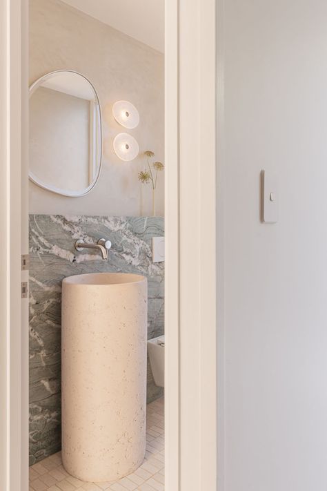 The downstairs powder room is punctuated with a bold vein of natural stone paired with micro-cement walls, mosaics, and a striking concrete pedestal basin perfectly serviced by ABI Interiors’ Elysian Minimal Mixer and Spout Set. Minimalist Powder Room, Concrete Pedestal, Most Beautiful Houses, Manifest Vision Board, Abi Interiors, Wc Bathroom, Cement Walls, Yellow Tile, Concrete Basin