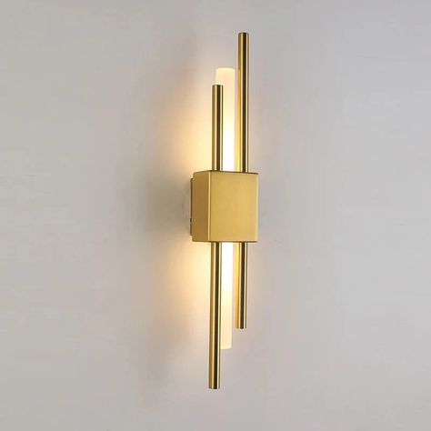 The Sparone Wall Sconce features a striking design with sleek metallic bars in a gold finish, providing an elegant yet contemporary look.💡 Its integrated LED lighting offers energy-efficient illumination, perfect for accentuating hallways, living rooms, or bedrooms with a touch of modern sophistication. #interiordesign #interiordesignideas #lampsdesign #homedecor #homedecorideas Hallway Wall Sconces, European Lighting, Contemporary Wall Lights, Bedside Wall Lights, Metal Wall Lamp, Hallway Wall, Modern Interior Decor, Iron Lighting, Modern Light Fixtures