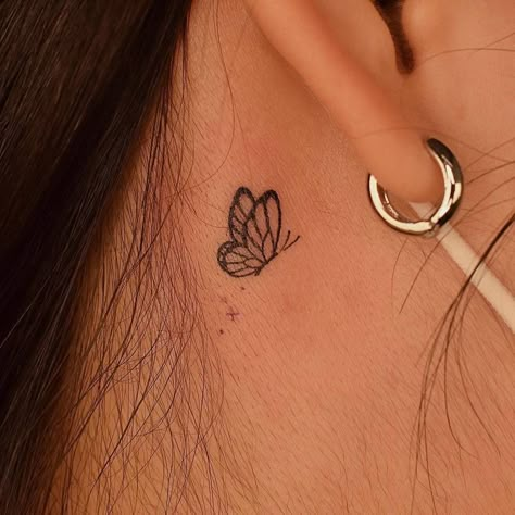 minimalistic butterfly tattoo located behind the ear. Back Of Ear Butterfly Tattoo, Mini Butterfly Tattoo Behind Ear, Half Butterfly Tattoo Behind Ear, Butterfly Hearts Tattoo, Minimalist Tattoos Behind Ear, Matching Tattoos For Best Friends Behind Ear, Dainty Butterfly Tattoo Behind Ear, Semi-colon Butterfly Tattoo Behind The Ear, Tiny Butterfly Tattoo Behind Ear