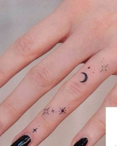 Discover 40 unique and trendy Girly hand tattoo ideas, perfect for expressing your style with elegance and creativity. Moon Phases Tattoo Finger, Small Star And Moon Tattoo, Finger Tattoos For Sisters, Crescent Moon Finger Tattoo, Small Moon And Star Tattoo, Moon Tattoo Hand, Sun Finger Tattoo, Star Finger Tattoo, Moon Finger Tattoo