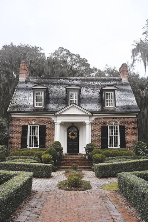 Classic brick house with black shutters and a welcoming wreath. The charm and quirks of 1920s houses, where elegance met the epitome of funky craftsmanship, all wrapped up with a touch of art deco flair. Brick House With Black Shutters, 1920s Houses, House With Black Shutters, 1920s Craftsman, White Front Door, Gingerbread Trim, Black Front Door, Green Shutters, Black Shutters