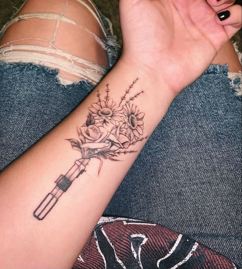 Star Wars Theme Tattoo, Star Wars Female Tattoo, Star Wars Tattoo With Flowers, Pretty Star Wars Tattoo, Sunflower And Rose Bouquet Tattoo, Star Wars Tattoo Flowers, Flower Lightsaber Tattoo, Matching Star Wars Tattoo Couples, Lightsaber With Flowers Tattoo