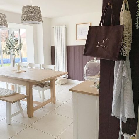 Kate on Instagram: "There’s still so many tweaks to be made. These lampshades need replacing and I’m still toying with the idea of having a rug under the dining table. But we’re getting there! #kitchendiner #kitchendesign #kitchen #kitcheninspo #familyroom #diningtable #diningroom #diningbench #panelling #panellingwalls #panelledwalls #clove #neptunehome #neptuneclove #kitchentiles #neutralhome #neutralhomedecor #neutralkitchen #neutralkitchendiner #frenchdoors #verticalradiator #sideboard #ne Neptune Paint Clove, Neptune Home, David Wilson Homes, Vertical Radiators, Neutral Kitchen, Kitchen Diner, Kitchen Tiles, New Builds, Lampshades