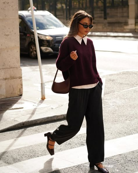 This ensemble is a great example of business casual attire with a twist. The deep burgundy sweater over a white collared shirt paired with loose-fitting trousers offers a polished yet relaxed look.


Photo credit by: @wendyswan Burgundy Bag Outfit, Library Fits, Collared Shirt Outfits, Business Casual Outfits Winter, Office Ootd, Parisian Street Style, Business Casual Winter, Parisian Street, Burgundy Bag