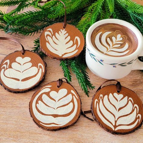 Starting ornament season with these painted wood slices in assorted latte art styles! ☕✨ . . . #handmadeornaments #handpaintedornaments #diyornaments #coffee #christmasornaments Christmas Ornaments On Wood Slices, Christmas Ornament Wood Slice, Painted Wooden Coasters, Painted Wood Slices, Glass Ornaments Diy, Coffee Ornaments, Coffee Painting, Wood Slice Ornament, Wood Christmas Ornaments