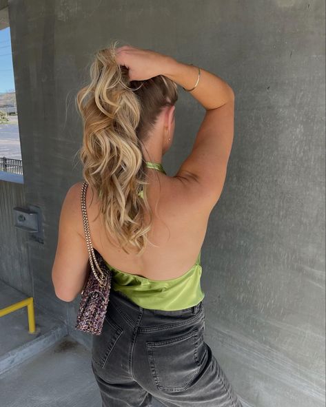 Holding blonde/bronde curled hair up in a parking garage pose with lime green silk halter neck top on and black jeans with a purple handbag and gold jewellery Holding Ponytail Pose, Fixing Hair Pose, Holding Hair Pose, Curled Hair Blonde, Fun Poses, Curled Hair, Ballet Art, Pose References, Poses Reference