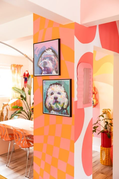 Colorful dog portraits on pink and orange walls. Colourful Painted Walls, Bold Wall Paint Ideas, Pink Fireplace, Orange Kitchen Walls, Maximalism Home, Orange Hallway, Maximalist Living Room, Hallway Paint, Deck Backyard