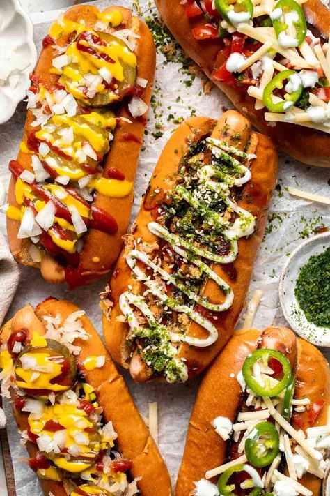 Juicy and delicious Gourmet Hot Dogs loaded with a variety of toppings will take your next backyard BBQ or potluck to a whole new level. Try them all! | aheadofthyme.com American Hot Dog Recipe, Fancy Hot Dogs Ideas, Gourmet Hotdogs Recipes, Loaded Hotdogs, Gourmet Hot Dog Bar, Hot Dog Toppings Ideas, Fancy Hot Dogs, Gourmet Hot Dogs Toppings, Hot Dog Photography