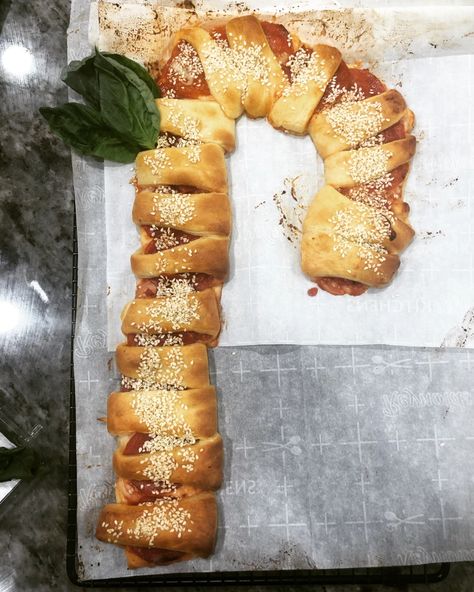 Pizza Candy Cane Crescent | Penny's Food Blog Candy Cane Bread, Crescent Dough, Cute Picture, Pizza Sauce, Shredded Mozzarella, Holiday Table, Holiday Tables, Fresh Basil, Parchment Paper