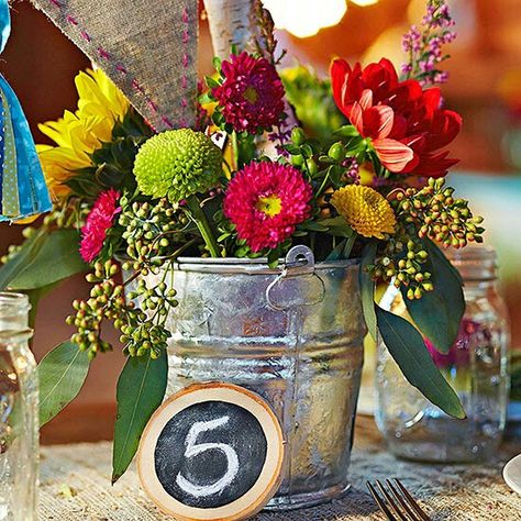 Wedding floral arrangement Wedding Glasses Diy, Bucket Wedding, Decorations On A Budget, Casual Bride, Tin Buckets, Frugal Wedding, Wedding Decorations On A Budget, Elegant Centerpieces, Wedding Centerpieces Diy