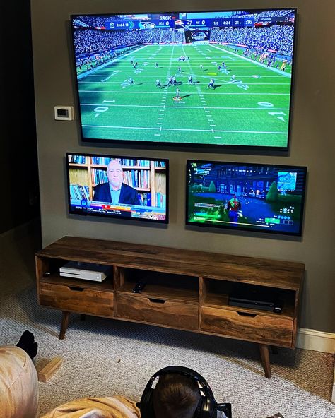 TV wall, Xbox, PlayStation, game room ideas, big Joe bean bags Video Game Area In Basement, Multi Tv Game Room, Man Cave Multiple Tv Set Up, 2 Tvs In Game Room, Xbox Tv Setup, Family Video Game Room, Man Cave Multiple Tvs, Two Tv Setup, Double Tv Game Room