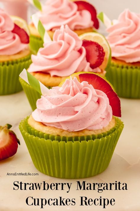 a close-up of a decorated strawberry margarita cupcake, several more cupcakes are in the background Tequila Cupcakes, Strawberry Margarita Cupcakes, Pineapple Margarita Recipe, Raspberry Margarita, Margarita Cupcakes, Lemonade Cupcakes, Unique Cupcakes, Boozy Desserts, Strawberry Margarita