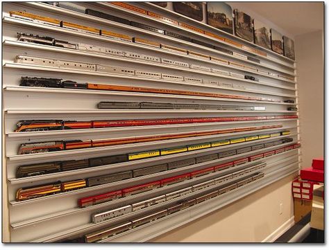 Love this wall mounted display method for a miniature train collection. Shelves For Collectibles, Wall Mounted Display Case, Model Train Display, Toy Trains Storage, Miniature Train, Train Display, Train Collection, Model Train Table, Model Train Accessories