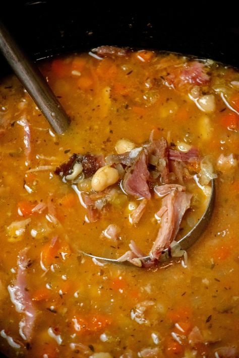 This easy Crock Pot Ham Bone and Bean Soup is a delicious and simple way to use up that leftover holiday ham bone, and comes together entirely in the crockpot! Crockpot Ham And Navy Bean Soup, Soup Made With Ham Bone Easy Recipes, Homemade Bean Soup Ham Bone, Ham Bone Lentil Soup Crockpot, Ham Bean Soup Crockpot Dried Beans, Hearty Ham And Bean Soup, Ham And Bean Soup With Ham Bone, Hammock And Beans Crockpot, Pinto Beans And Ham Crockpot