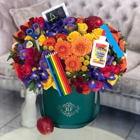 Our designers are so visionary! Start the school year off  with colorful blooms for students and teachers alike or any type of back-to-… Back To School Bouquet, 1 September School Decor, Teacher Bouquet, Handmade Teacher Gifts, Start Of Something New, Graduation Bouquet, Sweet Bouquet, School Celebration, Flower Boutique