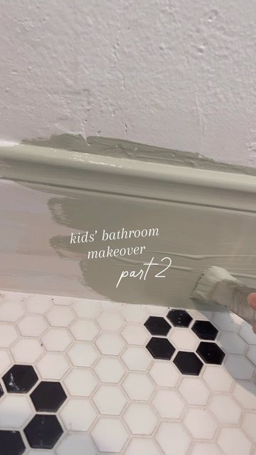 Regan Mauck | Blooming Nest on Instagram: "Kids bathroom update!!! Tons of paint happening! But I’m almost done!!! Details on tile paint can be found by clicking the link in my bio! Green paint color is contented and white is natural white both by Sherwin! Scallop trim also linked in my bio! Come back for the full reveal!!! #bathroomrenovation #beforeandafter" Painted Bathtub Tile, Painted Trim In Bathroom, Green Paint Bathroom Walls, Blooming Nest, Olive Green Bathrooms, Lavatory Design, Tile Paint, Creative Bathroom, Green Paint Colors