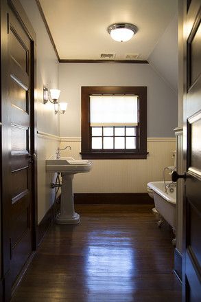 WSJ House of the Day: Enjoying a Restored Historic Home - WSJ Natural Wood Trim Bathroom, Bathroom With Dark Trim, Colored Wainscoting, White Wainscotting, Dark Woodwork, Waynes Coating, Farmhouse Trim, Dark Wood Trim, Light Walls