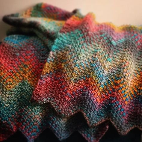 Yarnspirations | The Vibrancy! The moss stitch in this ripple throw showcases the rich jewel tones and swirling colors of the Paparazzi shade of Roll With… | Instagram Crochet Moss Stitch Ripple Blanket, Roll With It Melange Yarn Patterns, Moss Stitch Ripple Crochet, Linen Stitch Knitting, Moss Stitch Crochet Blanket, Ripple Crochet, Rich Jewel Tones, Crochet Ripple Blanket, Ripple Stitch