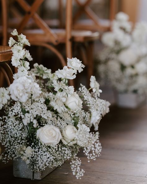 Modern meets whimsical in the most dreamy way! 🌿 A modern English barn wedding with all-white fluffy florals that looked so textured, graceful, and oh-so-pretty. For the tablescapes we added a floral runner A floral runner of white blooms and delicate roses brought the whole look together, making it the epitome of romantic, elegant, and modern vibes. If you’re dreaming of a modern barn wedding with a chic twist, this is it! 😍 Ready to bring your floral dreams to life? Get in touch so we c... Wedding Florals White, Wedding White Flowers, Modern Barn Wedding, Luxury Florists, Floral Runner, Ethereal Wedding, Modern English, White Florals, Wedding Flower Inspiration