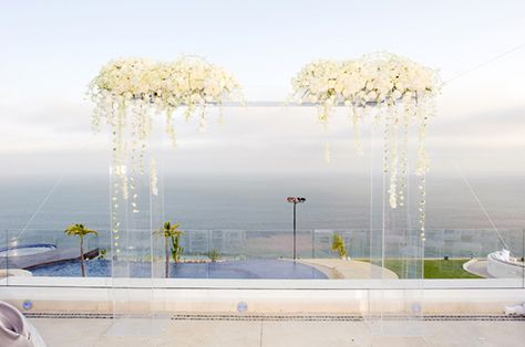 Acrylic Chuppah with White flowers - Rent yours today. 305 807 8014 Acrylic Arch, White Wedding Ceremony, Beach Wedding White, Beach Wedding Decorations Reception, Wedding Arches, Ceremony Design, California Wedding Photography, Wedding Ceremony Backdrop, Wedding Beach Ceremony