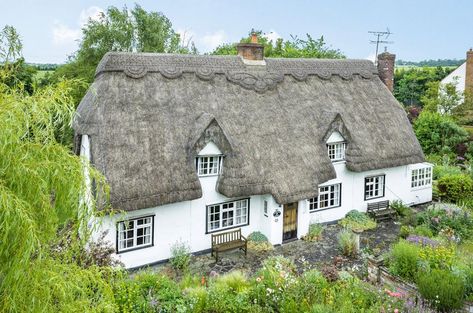 A charming thatched cottage set amongst wonderful landscaped gardens in Cambridge for sale at £725,000 Thatched Cottage Exterior, English Thatched Cottages, Cottage Thatched Roof, Thatched Cottages England, Inglenook Fireplace, Fairytale Cottage, Liverpool Street, Dutch Colonial, Timber Beams