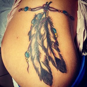 Feather Hip Tattoos, Native American Feather Tattoo, Feather Arrow Tattoo, Cherokee Tattoos, Eagle Feather Tattoos, Indian Tattoo Design, Cowgirl Photography, Botanical Tattoos, Indian Feather Tattoos